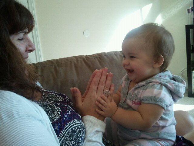 Nana and Ayda playing patty cake